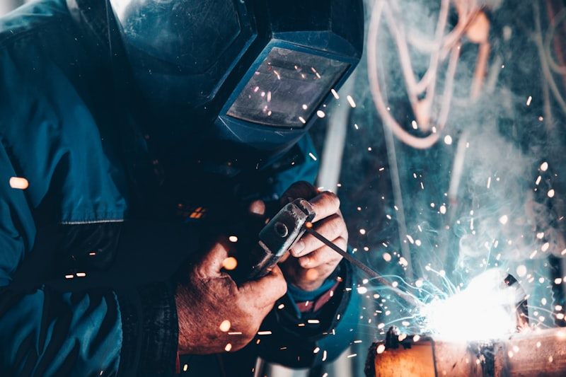 Technician welding in the Automozai workshop