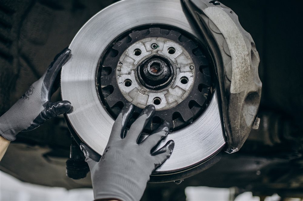 Mechanic inspecting a brake disc